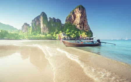 boats on Railay beach in Krabi Thailandの写真素材