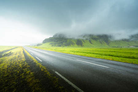 Icelandic landscape with asphalt roadの写真素材