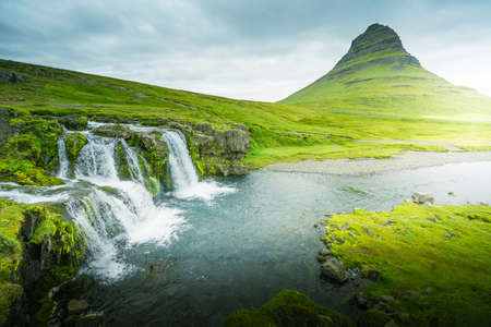 Kirkjufellsfoss Waterfall and Kirkjufell mountainの写真素材
