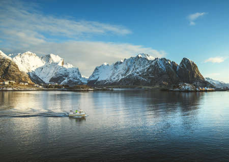 fishing boat and Reine Village, Lofoten Islands, Norwayの素材 [FY310158568257]