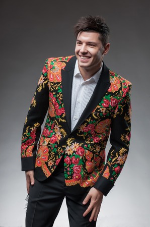 waist up portrait of young handsome man wearing elegant suit. looking to the right , on a white isolated backgroundの写真素材