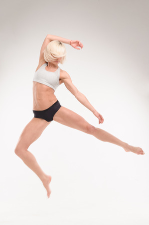 dance moves girls. sexy muscular body isolated on white backgroundの写真素材