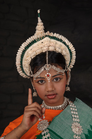 I have one good idea. Pretty Indian girl shows index finger upの写真素材