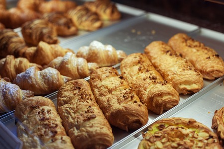 Close up of sweet varied baked products in bakehouseの写真素材