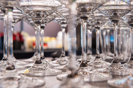 Close up of empty cocktail glasses on bar counterの写真素材