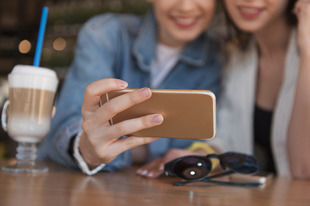 close up of a smartphone in the hand of a woman