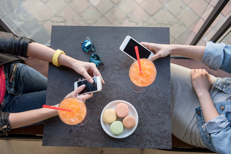 top view of a women checking their smartphonesの写真素材