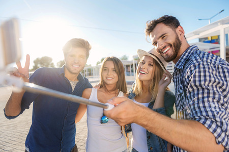 selective focus on people taking a selfie outdoorsの写真素材