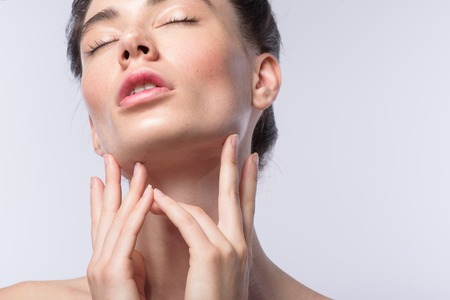 skin care concept, face of a relaxed woman with closed eyes and copy spaceの写真素材