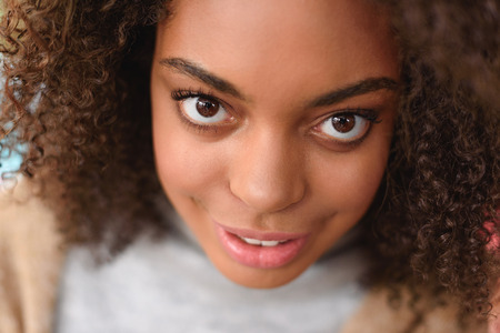 close up face of a young woman looking into a cameraの写真素材
