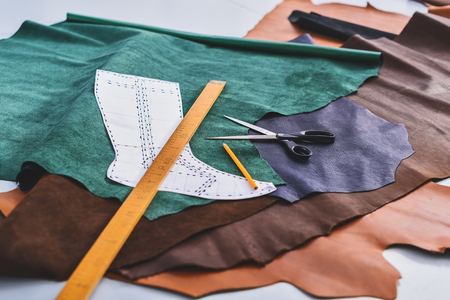 tools of a cobbler on the pieces of leatherの写真素材