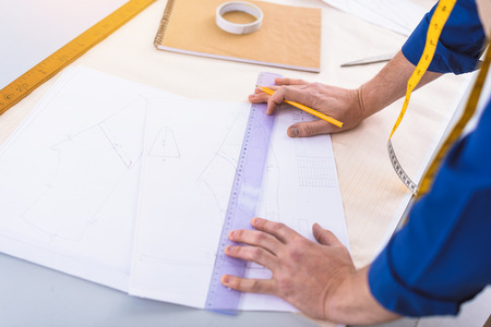 shoe artisan designing the shape of a new footwearの写真素材