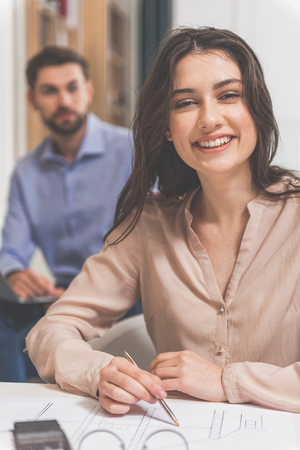 Cheerful designer enjoying her workの写真素材