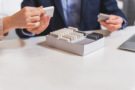 Professional salesman showing granite products to womanの写真素材