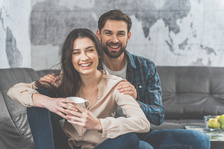 Voluptuous young couple having rest togetherの写真素材
