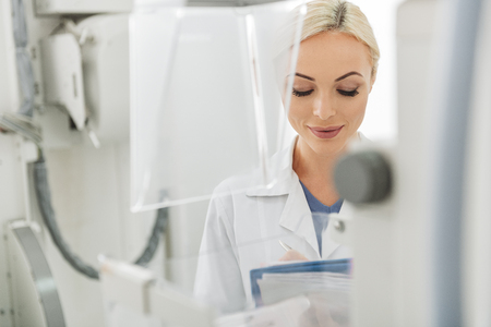 Smiling female doctor doing her workの写真素材