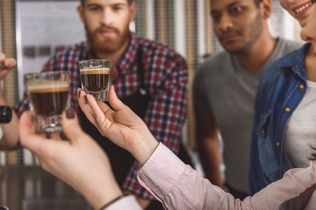 Well-made tasty espresso in hands of womanの写真素材