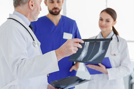 Smart doctors discussing x-ray photo
