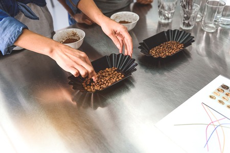 Roasted beans in black platesの写真素材