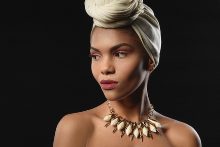 Elegant mulatto girl in turbanの写真素材