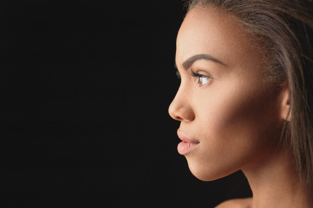 Passionate young african woman observing somethingの写真素材
