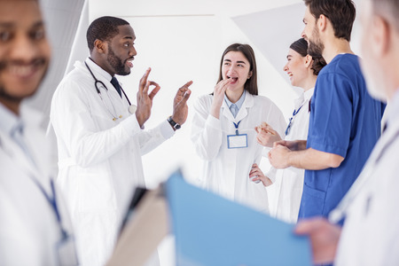 Outgoing doctors telling during pause in hospitalの写真素材