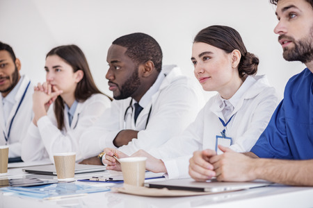 Outgoing doctors listening lecture at conferenceの写真素材