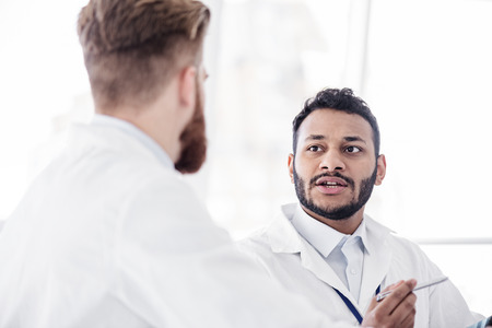 Thrilled therapeutic discussing with partner during meetingの写真素材