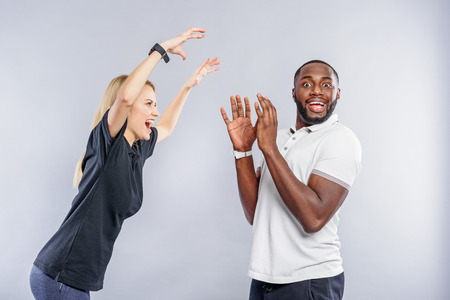 Carefree young man and woman playing for fun