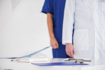 Documents of physicians on desk in clinicの写真素材