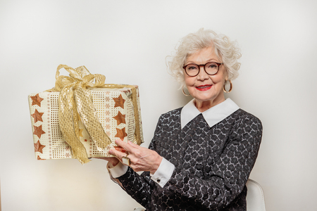 Joyful senior lady showing presentの写真素材