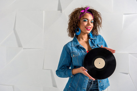 Outgoing african female holding music platterの写真素材