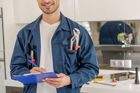 Happy smiling service man with map-caseの写真素材