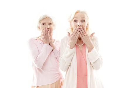 Senior ladies expressing their surpriseの写真素材