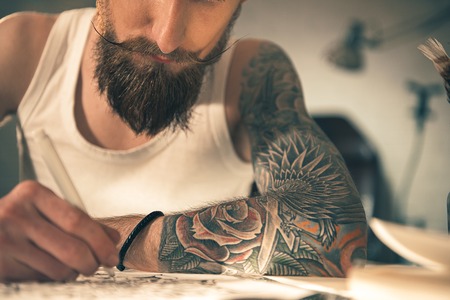 Male with image on arm drawing artの写真素材