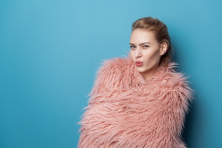 Happy flirting girl cocking eyesの写真素材