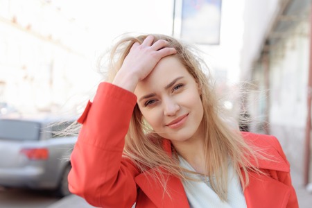 Sensual blond girl enjoying walk in cityの写真素材