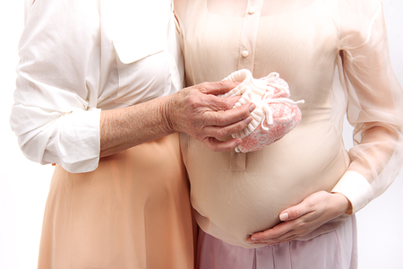 Mature female person hugging her younger oneの写真素材