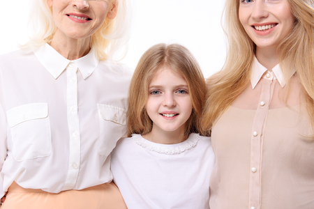 Brightly smiling women and girl