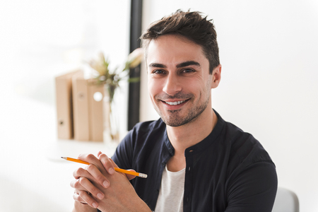 Cheerful smiling male office workerの写真素材