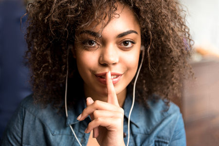 Outgoing woman hearing song with headset