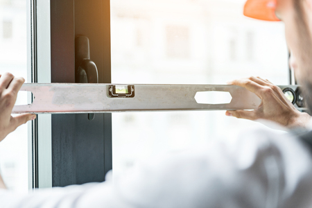 Male contractor keeping special instrumentの写真素材