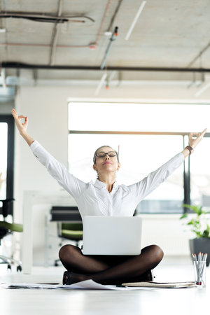 Serene female relaxing in roomの写真素材