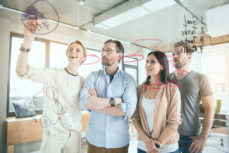 Cheerful team working together with graphics