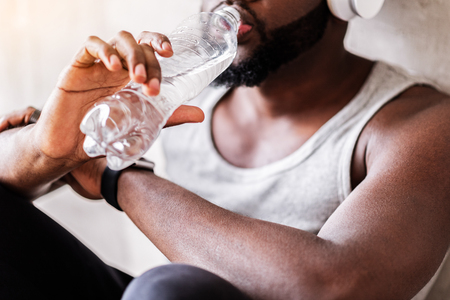 Muscular african man having relaxation timeの写真素材