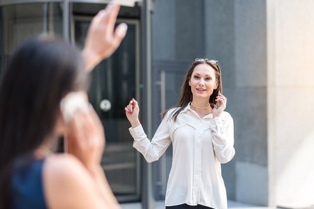 Happy female telling by phoneの写真素材