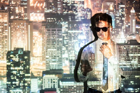 Serene male watching at phoneの写真素材