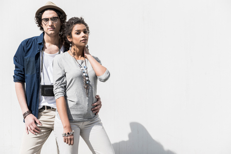 Pleasant stylish guy is embracing attractive girlの写真素材