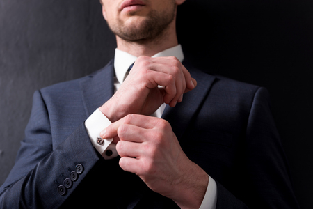 Stylish confident man is standing pensively
