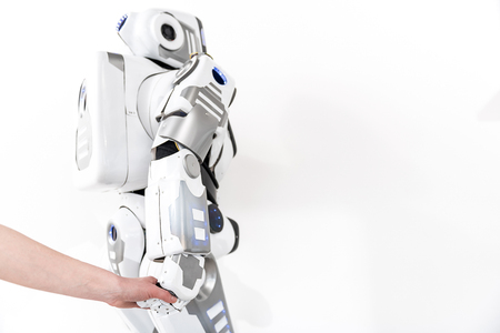 Creature of robotics taking earthborn handの写真素材